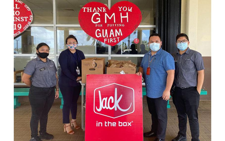 Jack in the Box General Manager Julz Coronel, far right, and Jack in the Box Assistant Manager Kimberly Quidachay, far left, present the Guam Memorial Hospital team, represented by Administrative Assistant Justine Camacho, second from left, and Administrative Officer Theo Pangelinan, third from left, a donation of Jack in the Box sandwiches.