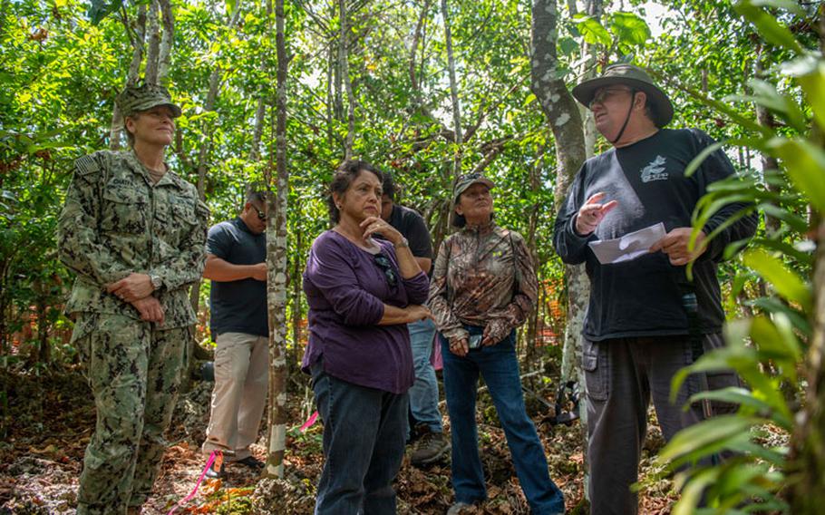 ANDERSEN AIR FORCE BASE, Guam (June 3, 2019) - Jim McConnell, Serianthes nelsonii principal investigator, Guam Plant Extinction Prevention Program, describes the Serianthes nelsonii tree to Rear Adm. Shoshana Chatfield, commander, Joint Region Marianas, left, and Guam Gov. Lou Leon Guerrero, center, during a visit to the tree at Andersen Air Force Base June 3. (U.S. Navy photo by Alana Chargualaf)