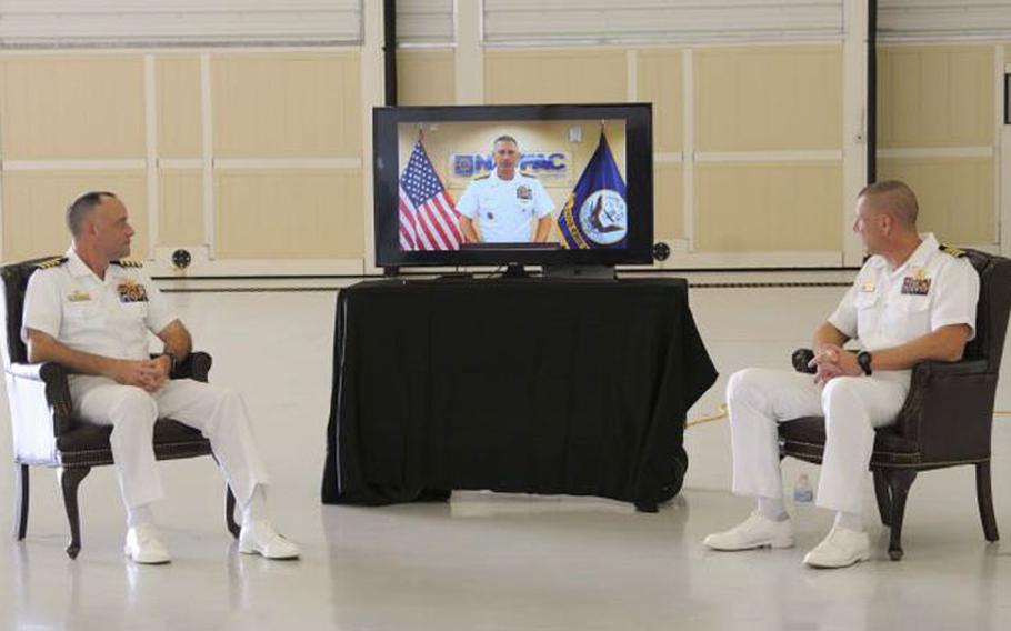 ANDERSEN AIR FORCE BASE (Aug. 21, 2020) - Rear Adm. John Adametz, Naval Facilities Engineering Command Pacific commander, delivers remarks virtually during the Officer in Charge of Construction Marine Corps Marianas change of command ceremony at Andersen Air Force Base Aug. 21. During the ceremony, Capt. Steven Stasick, right, relieved Capt. Joseph Greeson as commanding officer. (U.S. Navy photo by JoAnna Delfin)