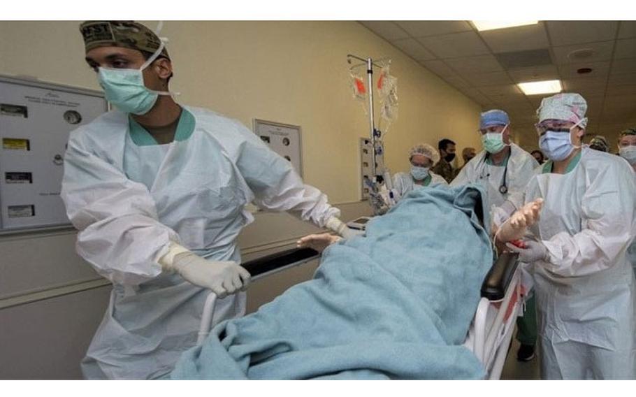 Members of the 555th Forward Surgical Team rush a simulated trauma patient to surgery during training with the Strategic Trauma Readiness Center of San Antonio (STaRC) at Brooke Army Medical Center, Fort Sam Houston, Texas. (Photo by Jason Edwards, Brooke Army Medical Center.)