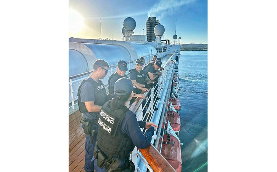 In an operation ensuring the safety and security of Guam’s maritime borders, U.S. Coast Guard Forces Micronesia/Sector Guam Sector Boarding Team personnel confer after completing a security boarding on the MS Zuiderdam, a Vista-class cruise ship operated by Holland America Line, upon its arrival on Feb. 18, 2024. This operation underscores the commitment of the U.S. Coast Guard to safeguarding the Port of Guam and the larger region’s maritime domain.