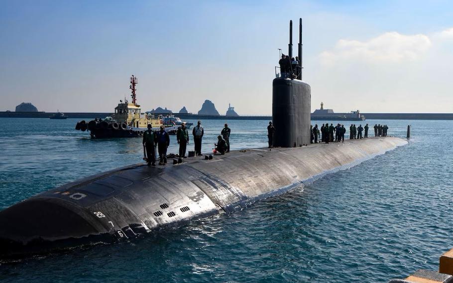 Tugboats assist the Los Angeles-class fast-attack submarine USS Springfield (SSN 761) as it pulls into port in Busan, Feb. 23. Springfield is one of four Los Angeles-class fast-attack submarines forward deployed to the island of Guam and assigned to Commander, Submarine Squadron (CSS) 15. CSS-15 is responsible for providing training, material and personnel readiness support to multiple Los Angeles-class fast-attack submarines and is located at Polaris Point, Naval Base Guam. (U.S. Navy photo by Mass Communi