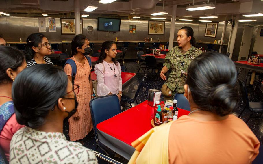 Lt. Kelly Chung, the legal officer aboard the Emory S. Land-class submarine tender USS Frank Cable (AS 40), speaks with students from St. Joseph’s College for Women during a tour of the ship while moored in Visakhapatnam, India, Aug. 2, 2022. Frank Cable is currently on patrol conducting expeditionary maintenance and logistics in the 7th Fleet area of operations in support of a free and open Indo-Pacific. (U.S. Navy photo by Mass Communication Specialist 2nd Class Kaitlyn E. Eads)