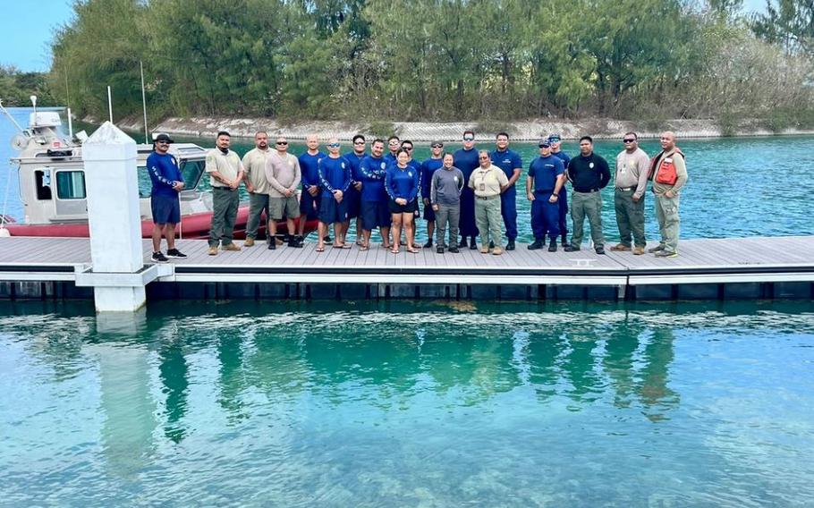 U.S. Coast Guard members from U.S. Coast Guard Forces Micronesia/Sector Guam take a moment for a photo with participants in a comprehensive subject matter expert exchange with multiple agencies in Tanapag, Saipan, CNMI, from April 12, 2024, to enhance inter-agency cooperation and proficiency in maritime operations.