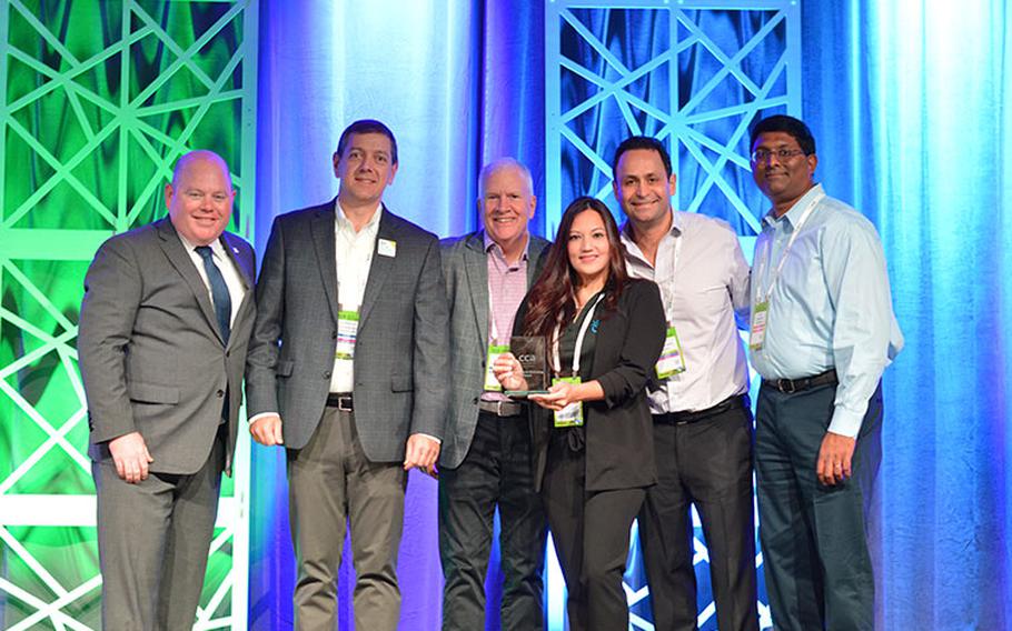 Michele Catahay Perez, Community Relations Manager at GTA, accepts the Outstanding Service Award at the Competitive Carriers Association Annual Convention in Portland, Oregon on Thursday, September 29.