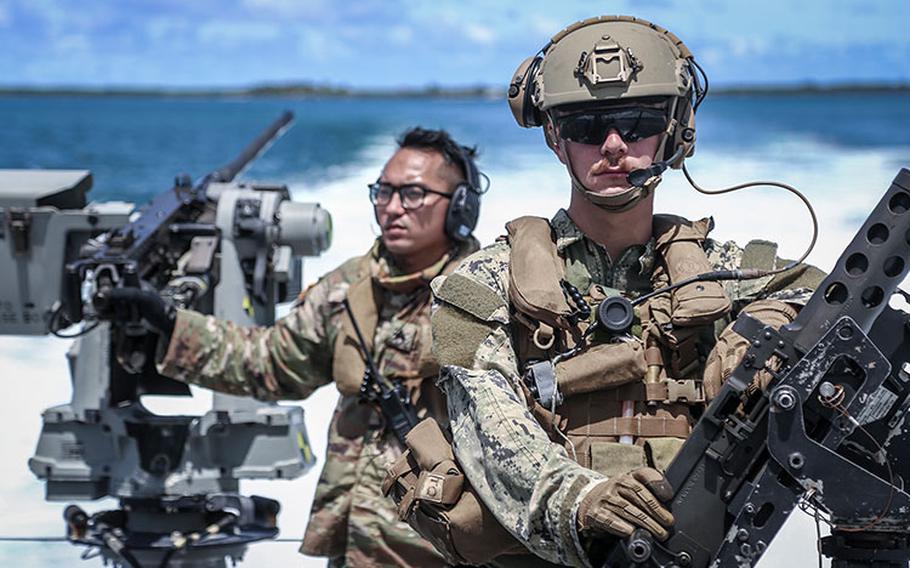 APRA HARBOR, Guam (Sept. 28, 2021) - Electronics Technician 3rd Class Paul Shaffer of Maritime Expeditionary Security Squadron (MSRON) 4, trains with Sgt. Keoni Wong, flight medic with the Guam Army National Guard, aboard a Mark VI Patrol Boat during a joint exercise in Guam, Sept. 28. The exercise, intended to familiarize the two units with casualty evacuation and interoperability, was the first of its kind for both the Guam Army National Guard and MSRON 4.