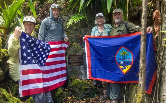 Photo Of George Tweed’s daughter Lolly Tweed, son-in-law Bradley Mulvihill, and two grandsons Brian and Casey Mulvihill pose in Tweed’s Cave on Marine Corps Base Camp Blaz, Guam, June 24, 2024.