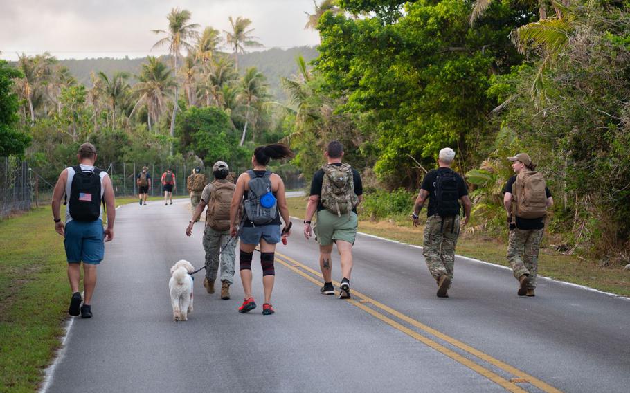 U.S. military members and families participate in a six mile Security Forces Memorial Ruck during Police Week at Andersen Air Force Base, Guam.