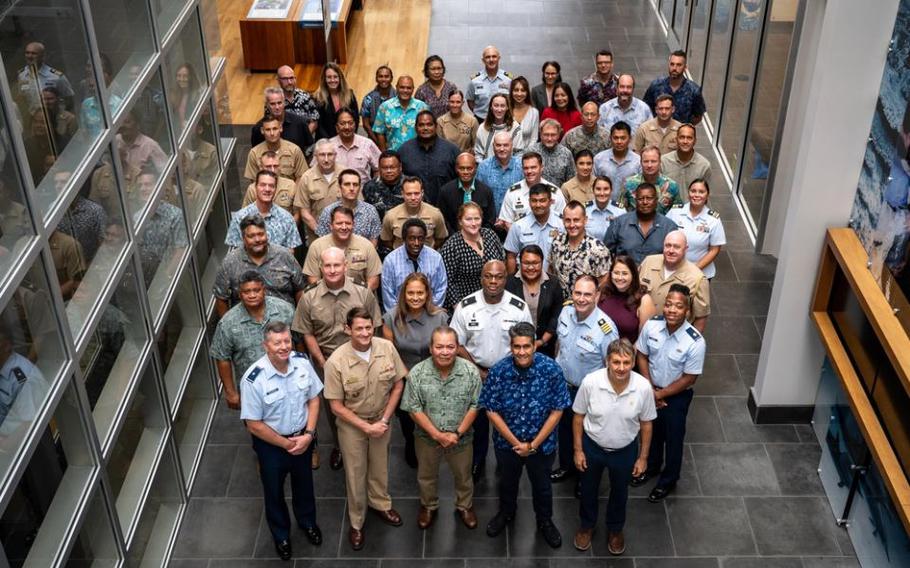 President Surangel Whipps of Palau, front (blue shirt), poses for a group photo while attending an executive level joint committee meeting at the National Oceanic and Atmospheric Administration building in Pearl Harbor, Hawaii, March 20. Under the 1994 Compact of Free Association agreement, the U.S. and Palau sustain deep ties and cooperation on a broad range of matters.