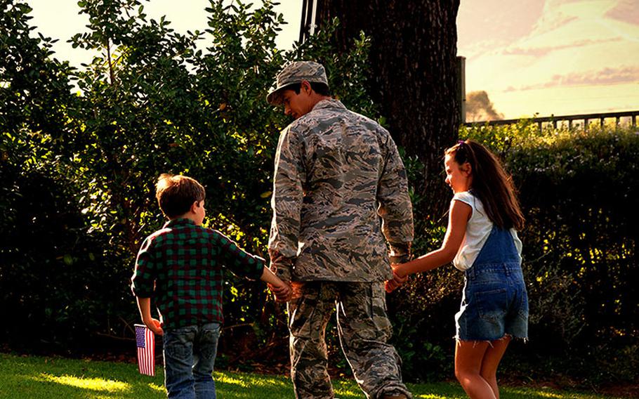 military family holding hands