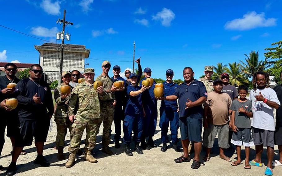 U.S. Coast Guard and U.S. Navy members stand for a photo with community members in the Republic of Palau following a boating safety class on Dec. 28, 2023. The U.S. Coast Guard regularly works with partners in the Republic of Palau; this series of events was part of Pacific Partnership 2024, which is now, in its 19th iteration, the largest multinational humanitarian assistance and disaster relief preparedness mission conducted in the region. (U.S. Coast Guard photo)