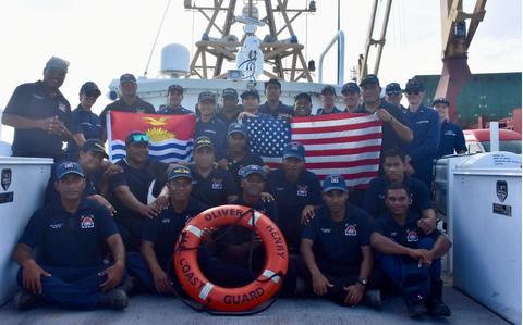 Photo Of The USCGC Oliver Henry (WPC 1140) crew and shipriders from the Kiribati Police Maritime Unit (PMU) with members of the U.S. Coast Guard International Maritime Training Team stand for a photo in Tarawa, Kiribati, on Feb. 16, 2024.