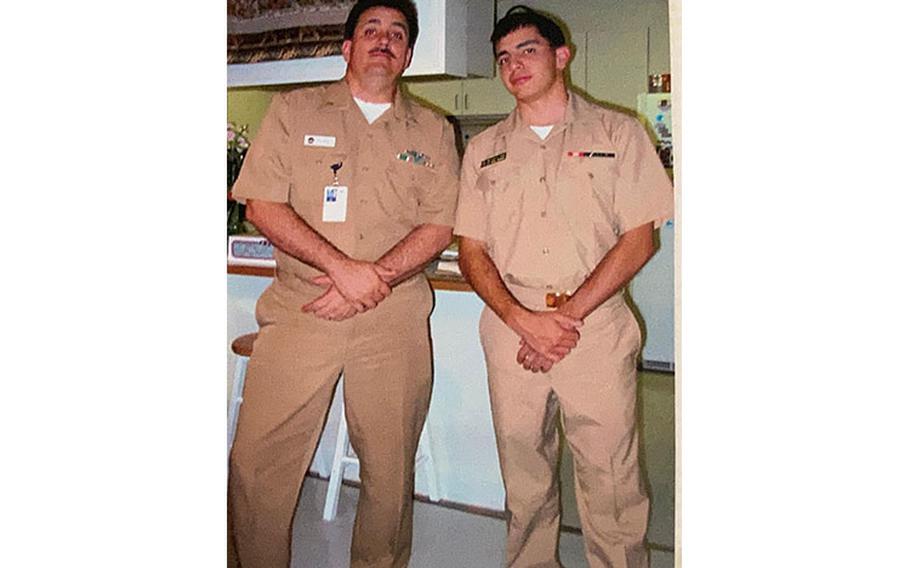 Santa Rita, Guam. (August 1, 2007) Midshipman Matthew Evans, from Yona, Guam, poses for a photo with his father, Senior Chief Fire Control Technician Matthew Evans. Evans is now a Lt. Cmdr. assigned to Commander, Submarine Squadron 15 located in Santa Rita, Guam. (Courtesy photo by Lt. Cmdr. Matthew Evans)