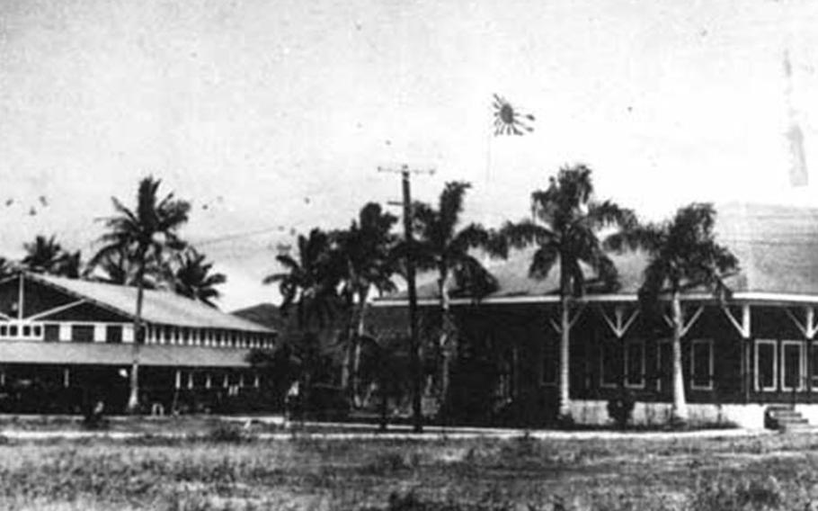 The flag of the Rising Sun sways in the wind above the Marine Barracks in Sumay. Though reminded every day of the Japa-nese presence in Guam, Chamorros never lost hope that America would return to liberate the island. Photo courtesy of War in the Pacific National Historic Park