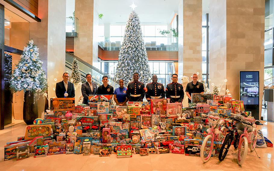 Left to right: Dean Huntsman, Regional Vice President – Dusit Guam, David Baldwin, General Manager – Dusit Beach Resort Guam, and US Marines – Cpl. Tylerruben Salas, Sgt. Andrea Rosem, LCpl. Jamesky Blanchard, GySgt. Mylokinski Abraham, Pfc. Dominic Servin, and Sgt. Stephen Smith. Photo courtesy of Dusit Guam