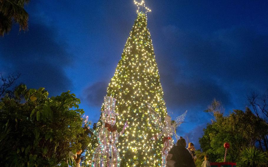 A tree lights up during the Tree Lighting Ceremony at Andersen Air Force Base, Guam, Dec. 1, 2023. The ceremony included music, hot chocolate, dance performances and meetings with Santa. (U.S. Air Force photo by Airman Lapaix)