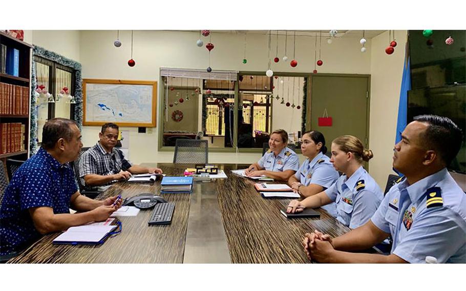 U.S. Coast Guard members meet with the Federated States of Micronesia Assistant Attorney General Mr. Jeffrey Tilfas and FSM Maritime Wing Commander Steward Peter to reaffirm mutual partnership during a visit in Pohnpei, FSM, Dec. 12-15, 2022. The expanded agreement was signed between the Federated States of Micronesia and the United States in October, supporting more robust bilateral maritime law enforcement operations. (U.S. Coast Guard photo)