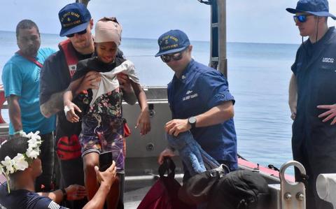 Photo Of The crew of USCGC Oliver Henry (WPC 1140) arrive to Woleai, Yap State, Federated States of Micronesia, on April 12, 2024, with an injured 9-year-old boy and his parents for further transport aboard a Pacific Mission Aviation flight to a higher level of medical care in Yap.