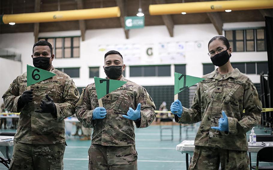 Soldiers and Airmen of the Guam National Guard operate a vaccination clinic at the University of Guam Calvo Field House in Mangilao on Jan. 27. Named Operation Liberate Guam, the Guam Guard's vaccination initiative aims to help the Guam Department of Public Health and Social Services achieve an 80% vaccination rate for the island by July 21 - Guam's Liberation Day.