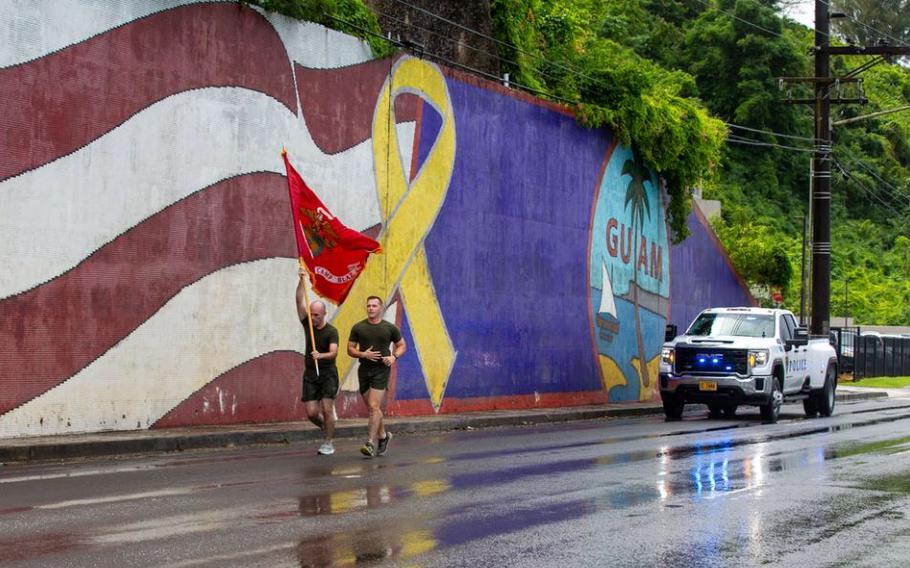 U.S. Marines with Marine Corps Base Camp Blaz, participate in a 249-mile run as a part of a celebration of the upcoming Marine Corps Birthday, Guam.