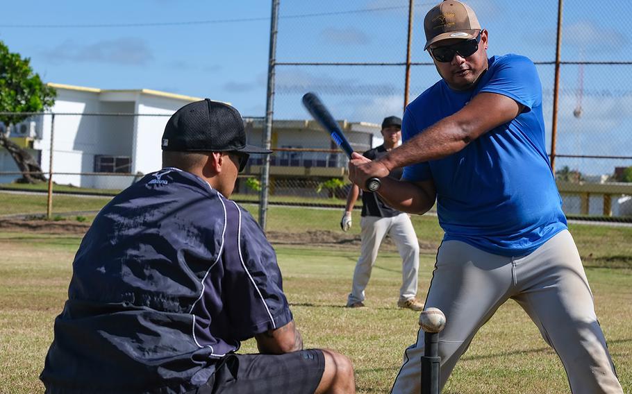 Jake Manuel practices his swing while Tritons Baseball Head Coach Roke Alcantara looks on during the University of Guam baseball tryouts held Dec. 5 on the George Washington High School baseball field. Photo courtesy of Triton Athletics