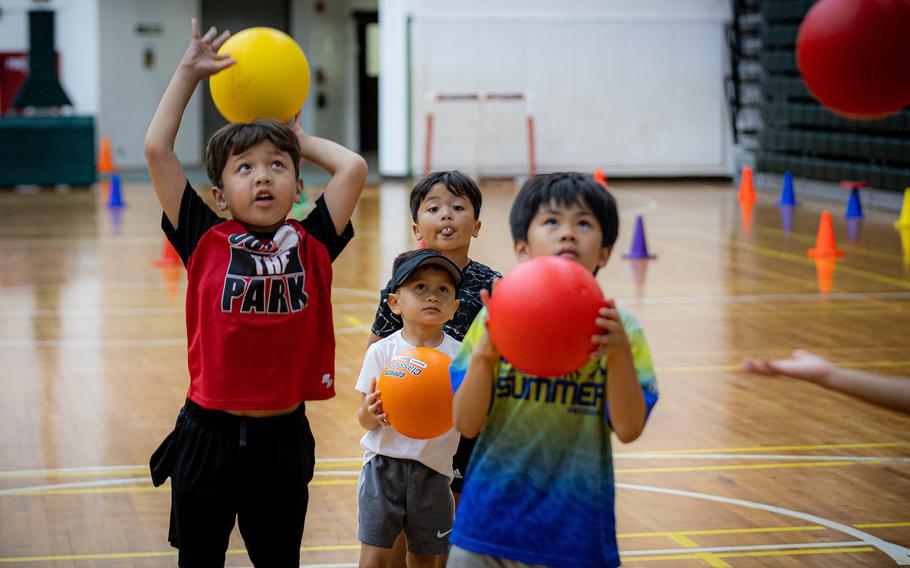 Kids practice their basketball skills during the Triton Athletics Sports Camp on Wednesday at the Calvo Field House.  (Photos courtesy of University of Guam)