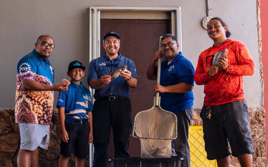 The University of Guam Sea Grant team donates tilapia to the Mangilao Mayor's Office for distribution to residents on May 26. From left, Assistant Director of Communications for UOG CIS/Sea Grant/EPSCoR Kyle Mandapat; Director Austin Shelton IV, UOG Center for Island Sustainability and Sea Grant; Mangilao Vice Mayor Kevin Delgado and UOG Sea Grant Aquaculture Project Assistant Johnny Borja.