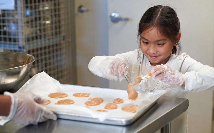 Isabella Iriarte makes snickerdoodle applesauce cookies during the Sew, Stitch, and Fun in the Kitchen summer camp.