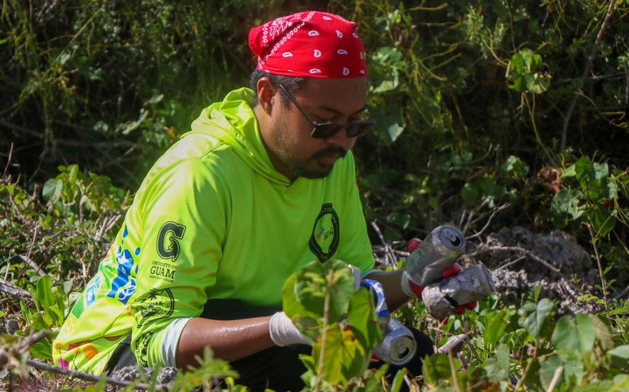 Rico Lizama of the Guam Green Growth Conservation Corps’ fourth season, sifts through recycleable aluminum cans during an island beautification event.