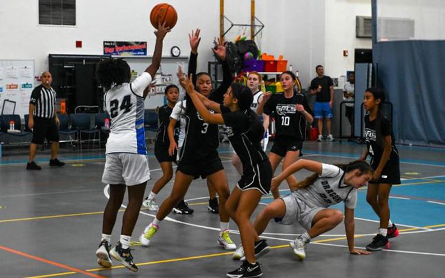 Azariah Murrell, captain of the Andersen Middle School girls’ varsity basketball team, dribbles the ball down the court on during a game versus the Saint Francis Catholic School on Andersen Air Force Base, Guam, May 2, 2023. The girls used teamwork and communication to keep the scoring lead throughout the game. (U.S. Air Force photo by Airman Allon Lapaix)