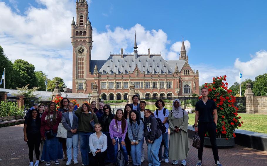 Tyra Delos Reyes, far left, joins her classmates for a photo in front of the International Court of Justice in The Hague.