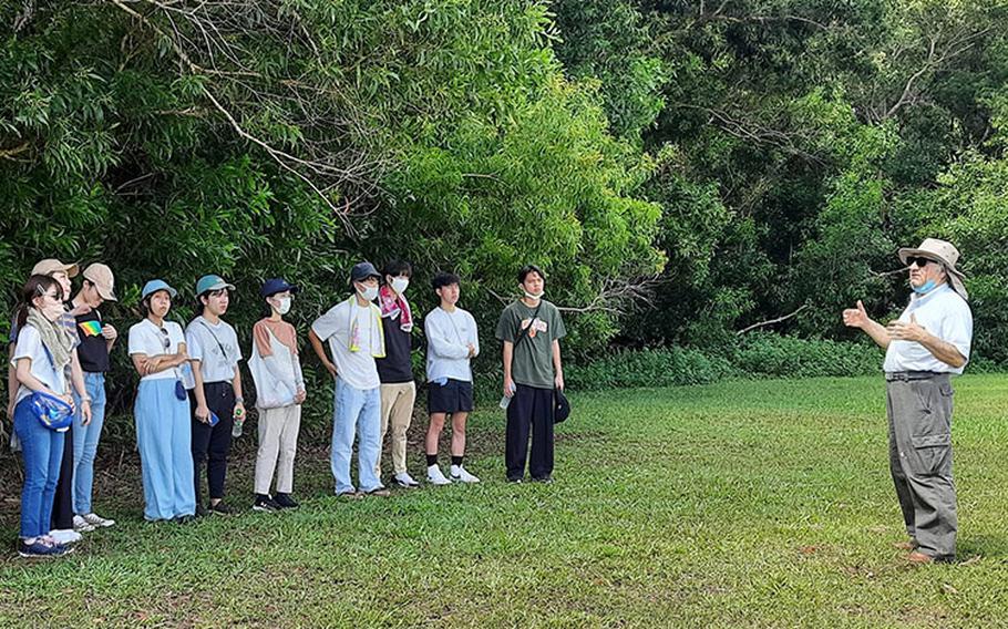 Mohammad H. Golabi, professor of soil and environmental sciences at the College of Natural and Applied Sciences at UOG, discusses his biochar study with visiting students from Japan in September 2022.