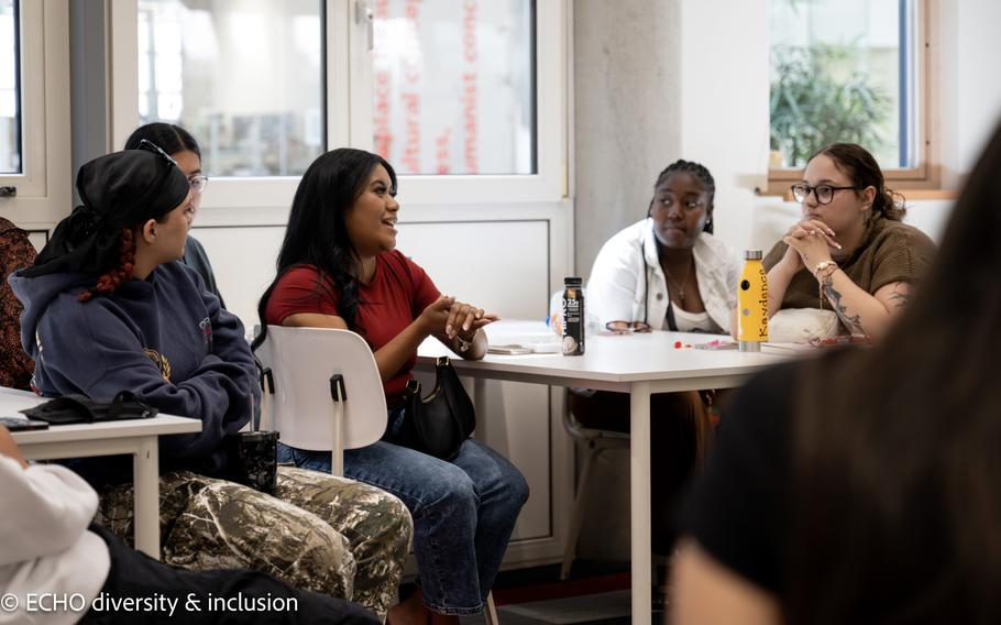Tyra Delos Reyes, center, participates in a class discussion at The Hague University of Applied Sciences.