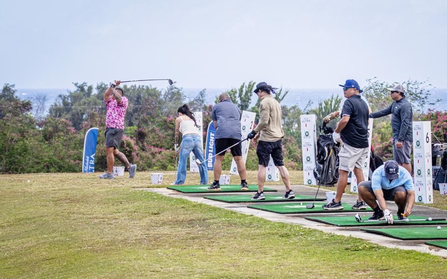 Golfers line up to “Drive Education Fore-ward” at the University of Guam Golf Challenge held at Country Club of the Pacific.