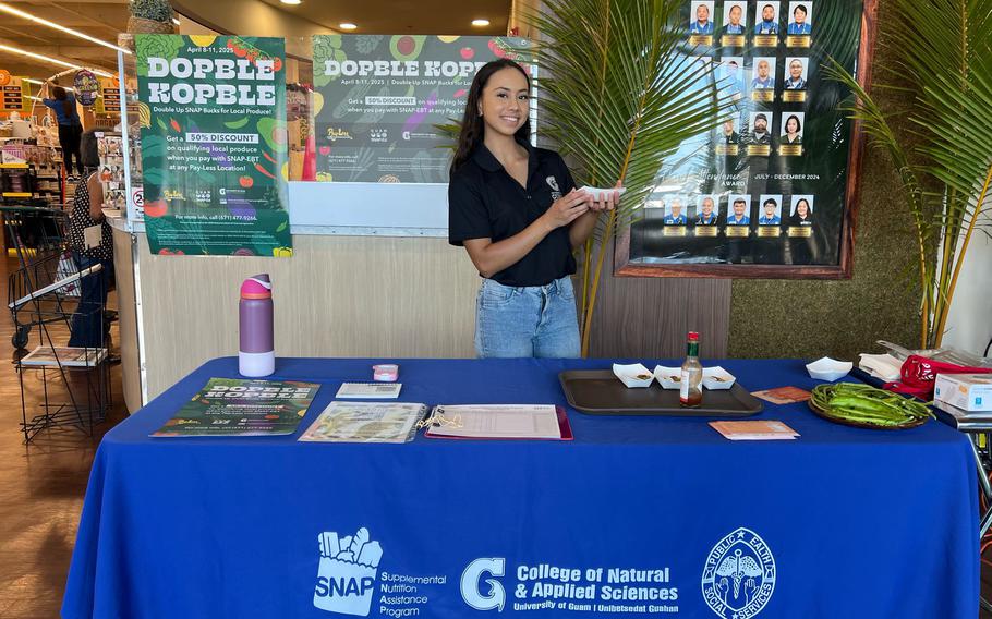 Sophie Santos, a Guam SNAP-Ed educator with University of Guam Cooperative Extension & Outreach, provides samples of a local dish made with sigidiyas (winged beans) during a SNAP-Ed cooking demonstration at the Pay-Less Supermarket in Maite.