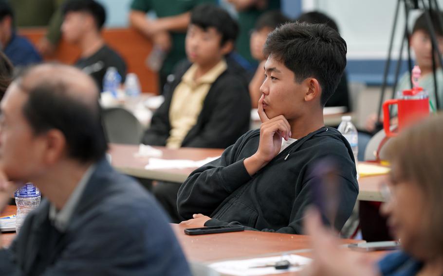 Leon Park, a student from John F. Kennedy High School, carefully considers a pattern in a set of numbers during the guest lecture at UOG’s Math Day.