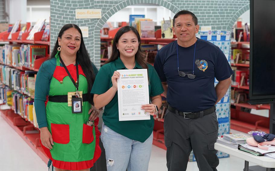 (From left) Tricia Lynn Alconaba, a professional school counselor at J.Q. San Miguel Elementary School; Katrina Macasaquit, a UOG extension associate with the SNAP-Ed program; and Elias Taisipic, principal of J.Q. San Miguel Elementary School. The school signed the 5-2-1-Almost None pledge on Dec. 13, 2024.