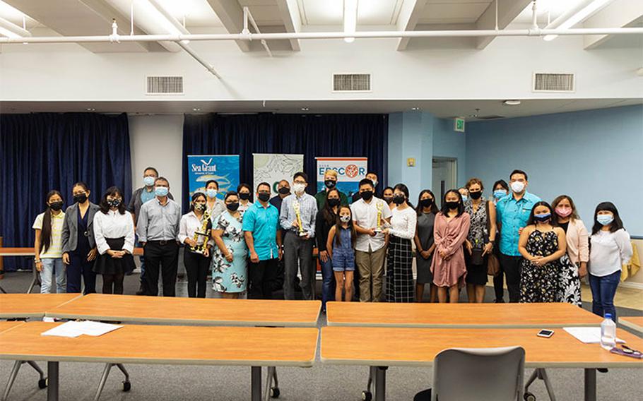 High school research interns of the 2021 National Science Foundation INCLUDES SEAS Islands Alliance Summer Science Program pose with their families and mentors at the program’s culminating science fair and symposium on July 2 at the University of Guam School of Business Public Administration. (Photos courtesy of the University of Guam Center for Island Sustainability)