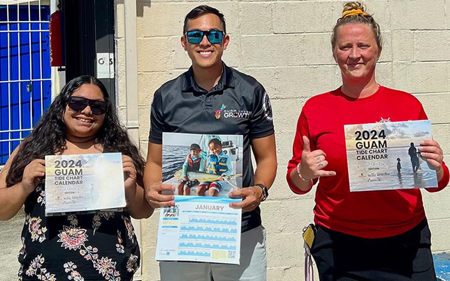 Gabriella Topasña and Phillip Cruz, Sustainability Coordinator for the Center for Island Sustainability, share the 2024 Guam Tide Chart Calendar with an employee at Axe Murderer Tours in Hagåtña recently. Photos courtesy of the University of Guam