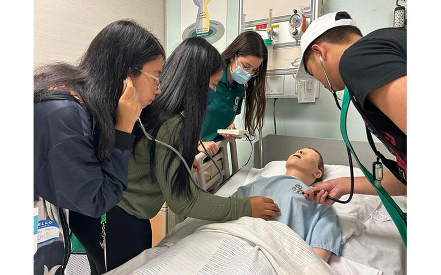 High school students from a prior Upward Bound summer program explore a possible career option at the University of Guam School of Nursing. Photo courtesy University of Guam