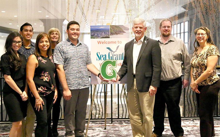 (From left) Rebecca Elmore; Philip Cruz; Fran Castro; Cathleen Moore-Linn; and Austin Shelton of the University of Guam with Jonathan Pennock, Joshua E. Brown, and Nikola M. Garber of the National Sea Grant Program at Sea Grant Week 2018 in Portland, Ore. Pennock, the director of the National Sea Grant College Program, will officially award the University of Guam institutional Sea Grant status at a ceremony to be held on Aug. 11 at the Calvo Field House. Photos courtesy of University of Guam