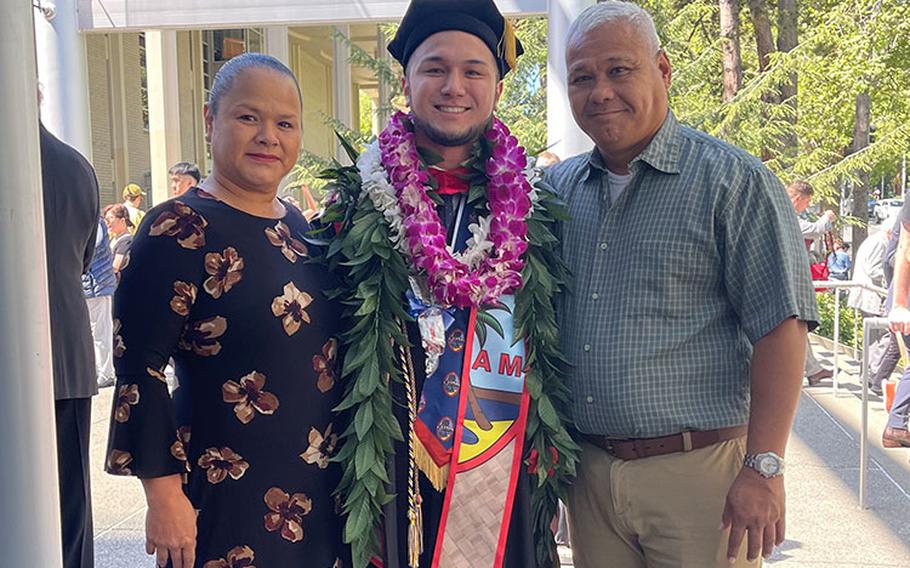 Travis John Cabe Aguon is joined by his parents John P.L. Aguon and Deborah C. Aguon at his graduation from Seattle University School of Law in May 2023.