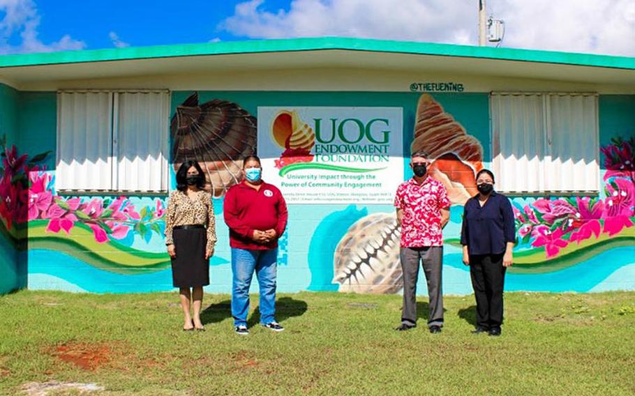 (From left) Anita Borja Enriquez, UOG senior vice president and provost; Mayor Allan Raymond Garcia Ungacta of Mangilao; Thomas Krise, UOG president; and Katrina Perez, executive director, UOG Endowment Foundation, at the unveiling of a mural on the UOG Endowment Foundation building on Sept. 20. Photo courtesy of University of Guam