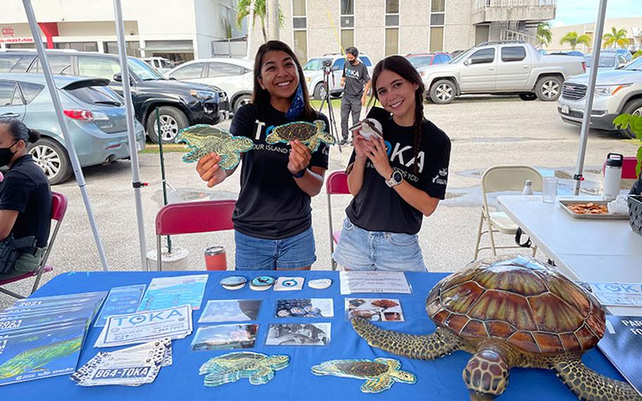 Leilani Sablan, left, and Addie Ferguson, University of Guam Sea Grant biologists, conduct green sea turtle (Chelonia mydas) community outreach during an event promoting the Toka mobile application on May 27, 2021, at Carabao Brewing in Hagåtña, Guam. Sablan and Ferguson conduct outreach activities throughout the island with presentations and exhibits at various events.