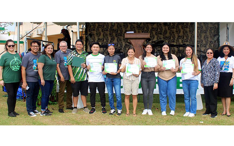 The scholarship recipients are joined by College of Natural & Applied Sciences Dean Lee Yudin and Senior Vice President and Provost Anita Borja Enriquez during Charter Day on March 2, 2023. From left, Shawn Wegner; Tim de La Cruz; Kristina Sayama; Dean Yudin; award recipients Christopher Certeza, Joshua Artuz, Laura Layan, Ha’åni Bettis, Lara Mozloum, Stephanie Santos, and Aubrie Uson; Katrina Perez; and Dr. Borja Enriquez. Photo courtesy of University of Guam