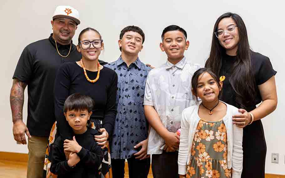 Drew Ann Laguaña (second from left, back row) and Jerusa Laguaña (far right, back row), daughters of the late Andrew T. Laguaña, pictured with their families during the scholarship announcement ceremony.