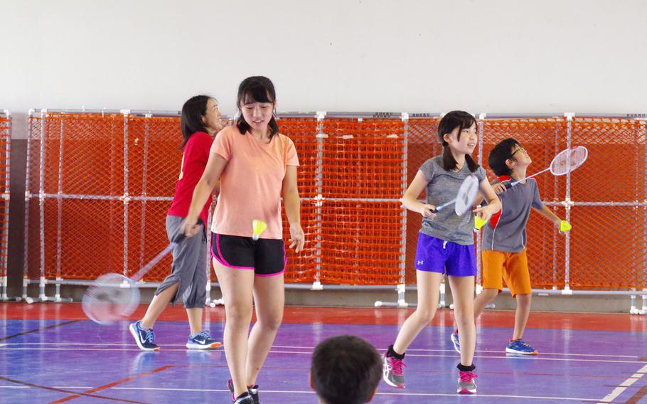 girls playing badminton