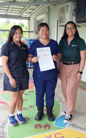 (From left) UOG extension associate Katrina Macasaquit, Sagan Fina’nå’guen Fino’ CHamoru Daycare Director Delilah Charfauros, and UOG extension associate Iesha Ibanez at the daycare’s 5-2-1-Almost None game board ribbon-cutting and pledge signing on July 16, 2024, in Dededo.