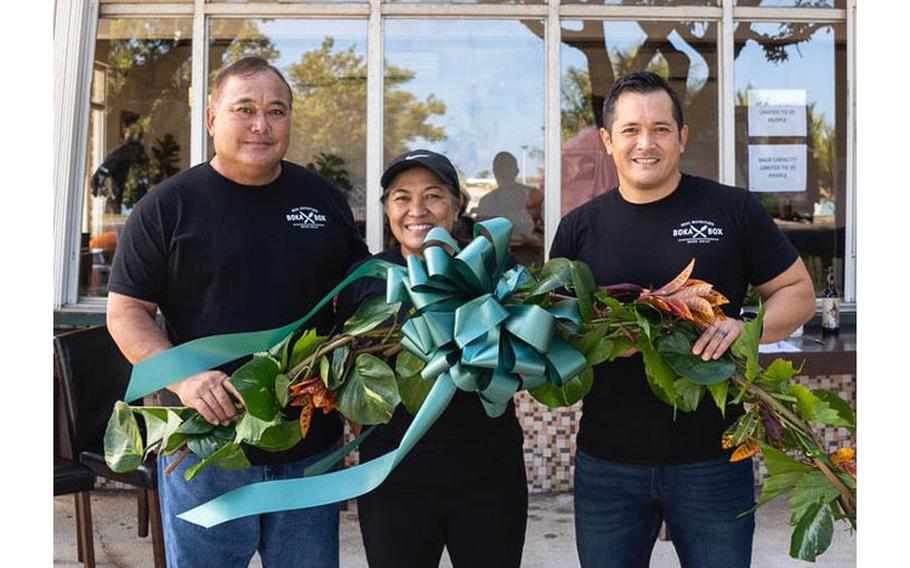 Left to right: The Boka Box owners Jessie Rosario, Julie Rosario, and Jessie Rosario, Jr. pose in front of their new establishment in West Soledad, Hagåtña