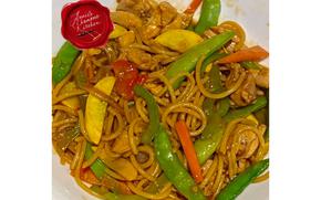 A full close-up of chicken stir fry with noodles.